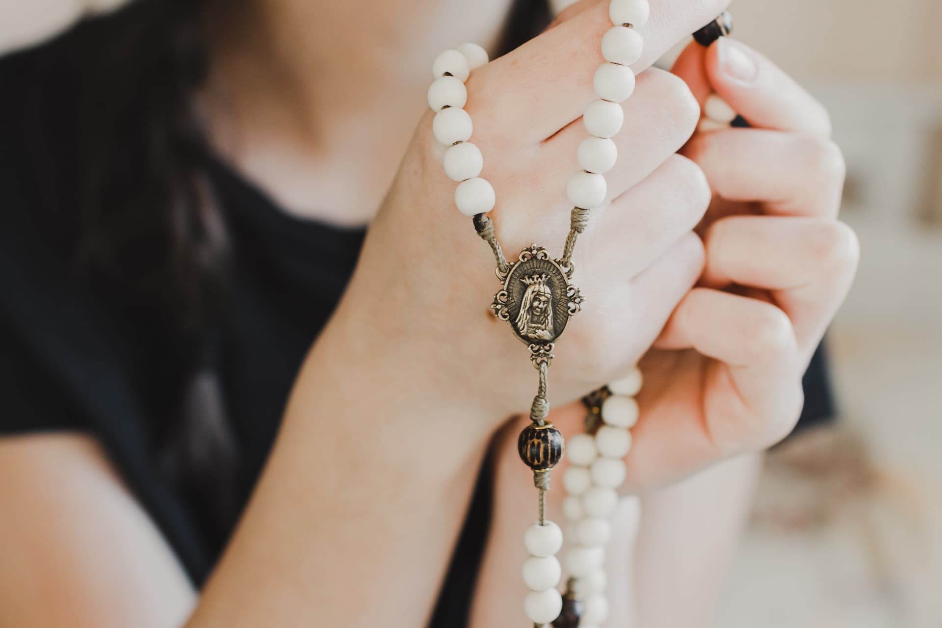 Girl holding a rosary