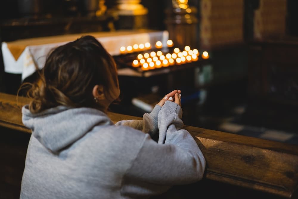 woman praying in a catholic church